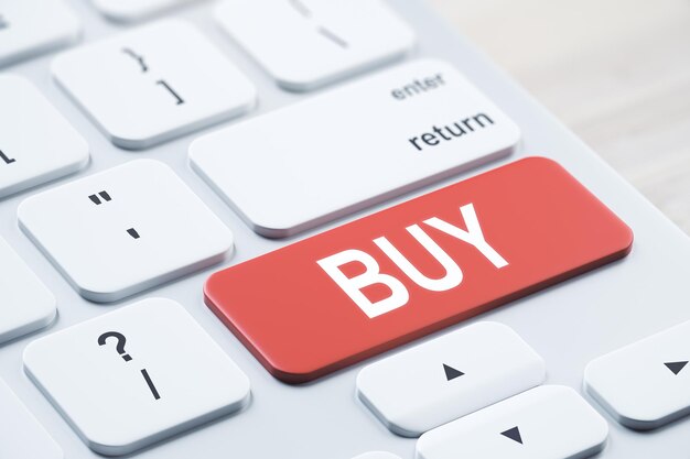 Close up of red buy button on white keyboard placed on blurry wooden desktop concept 3D Rendering