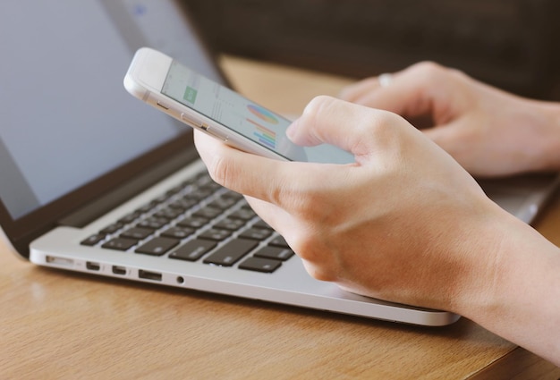 Close-up of woman using smart phone