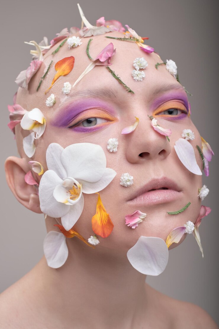 Fotoğraf close-up of woman with petals on face