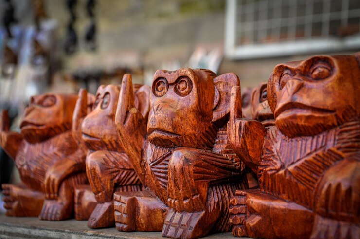 Fotoğraf close-up of wooden statues for sale in market