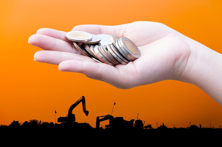 Fotoğraf coins in hands on industry silhouette landscape backgrounddonation investment fund financial support charity dividend market growth home house stock trust wealthy giving planned accounting