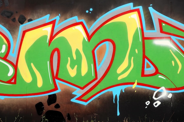 Colorful background of graffiti painting artwork with bright aerosol outlines on wall old school