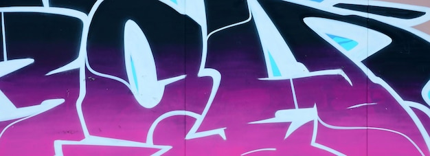 Colorful background of graffiti painting artwork with bright aerosol outlines on wall old school