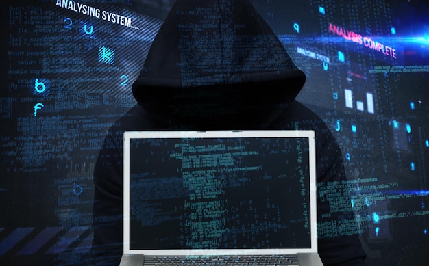 Composite image of burglar wearing black hooded jacket