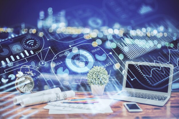 Computer on desktop in office with technology theme hologram Double exposure Tech concept