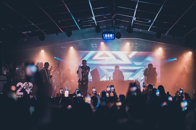 concert with singing public on stage urban party reggaeton party