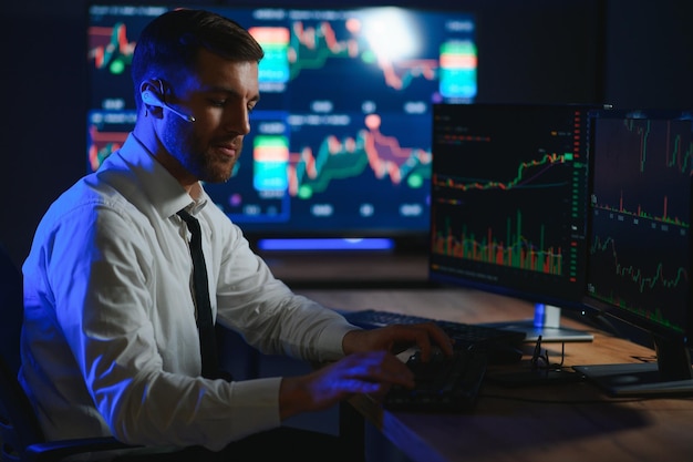 Crypto trader investor analyst looking at computer screen analyzing financial