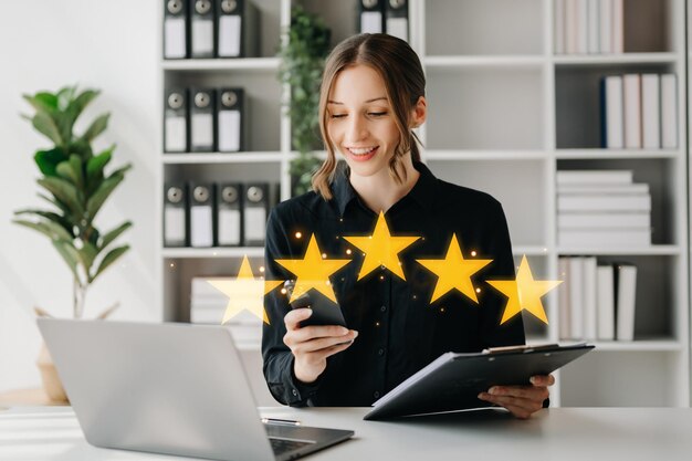Customer or client the stars to complete five stars with copy space giving a five star rating Service rating satisfaction concept in officexA