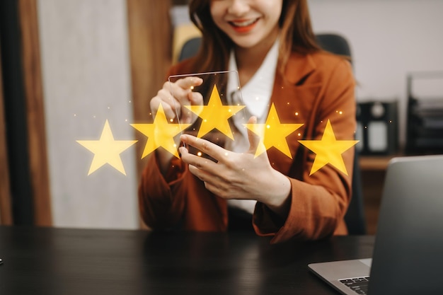 Customer or client the stars to complete five stars with copy space giving a five star rating Service rating satisfaction concept
