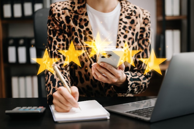Customer or client the stars to complete five stars with copy space giving a five star rating Service rating satisfaction concept