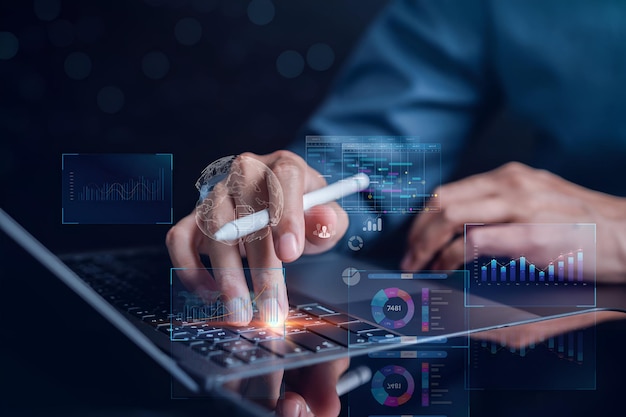 data analytics and analyst working with computer in business management system to make report with kpi and metrics connected to database