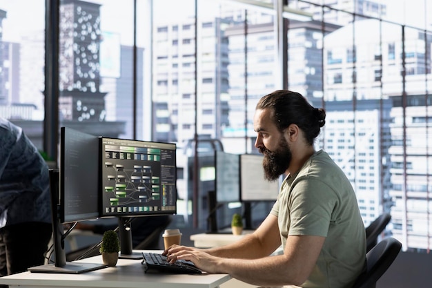 Data scientist at pc desk developing algorithms that enable machines to learn from data man in