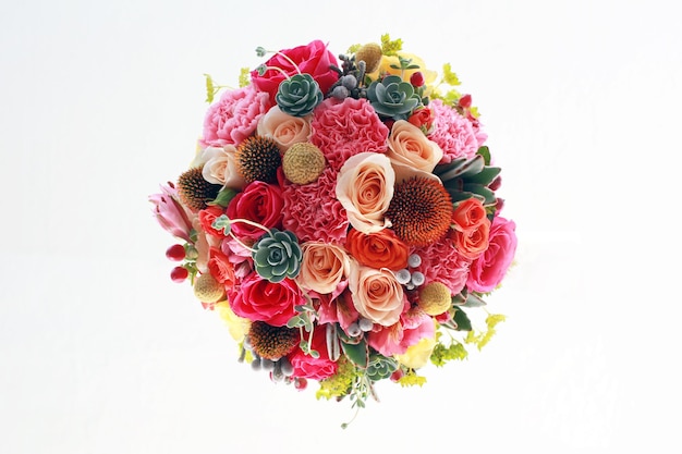 Directly above shot of colorful flowers bouquet against white background