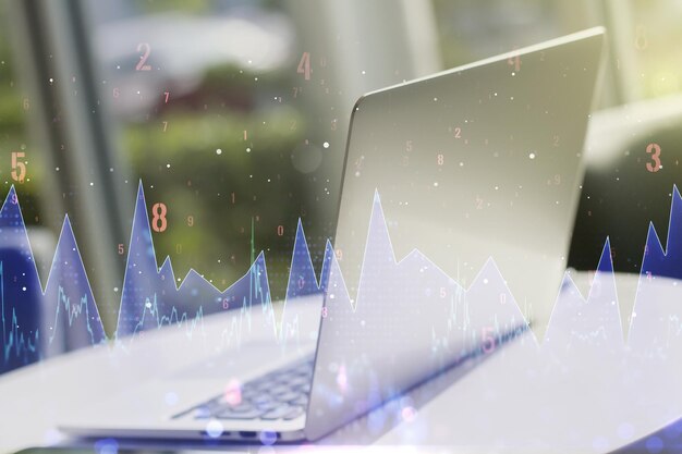 Double exposure of abstract creative statistics data hologram on laptop background statistics and analytics concept
