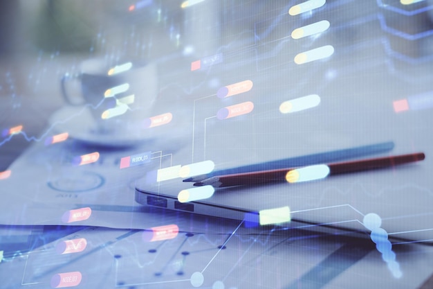 Double exposure of table with computer on background and data theme hologram Data technology concept
