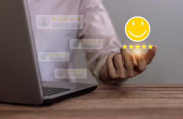 Excellence Review Young Man with laptop hand holding five star and emoji smile to review