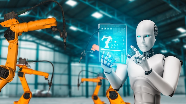 Fabrika üretiminde montaj için kullanılan mekanize endüstriyel robot ve robot kolları.
