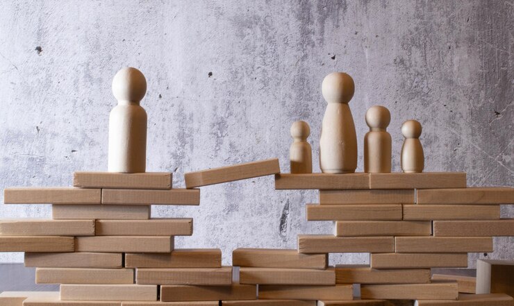 Fotoğraf family care protection and insurance concept wooden dolls family inside a house