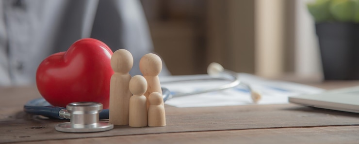 Fotoğraf family wooden doll and rad hard and medical stethoscope