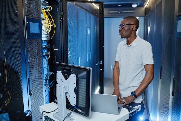 Female System Engineer in Server Room