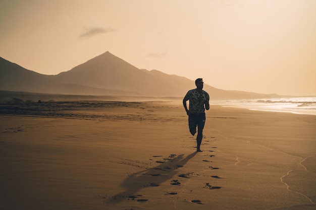 full length of man running at beach