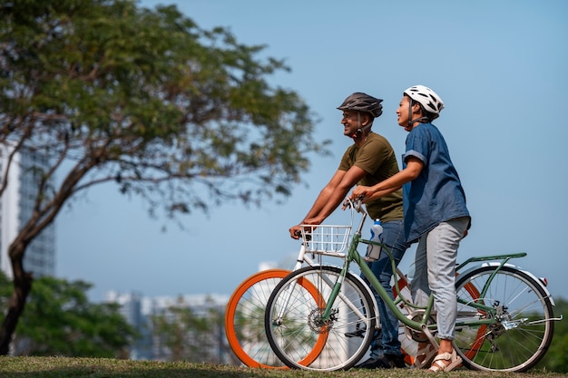 full shot family cycling outdoors