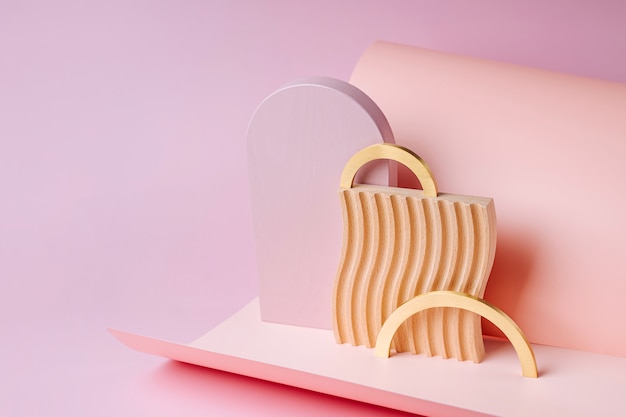 Golden arches  and wooden plate with waves  on a paper background