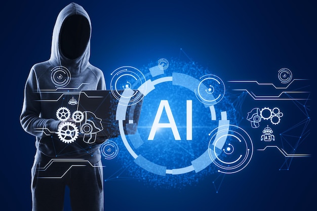 Hacker in hoodie using laptop with glowing AI hologram on blue background Artificial intelligence robotics and chat gpt concept