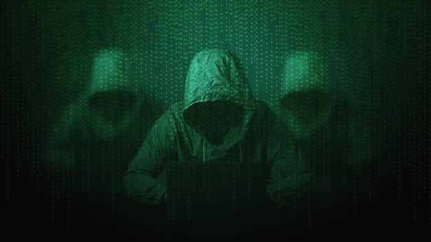hacker over a screen with binary code.cyber security concept.