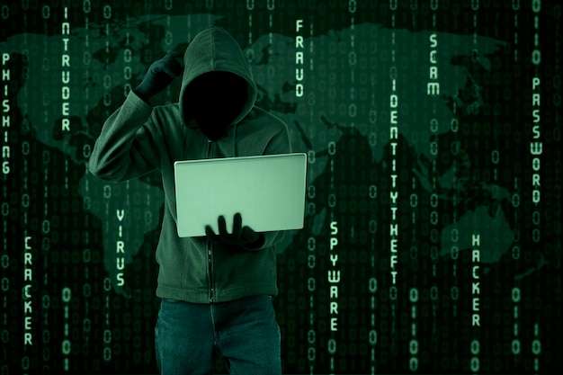Hacker using laptop against binary codes