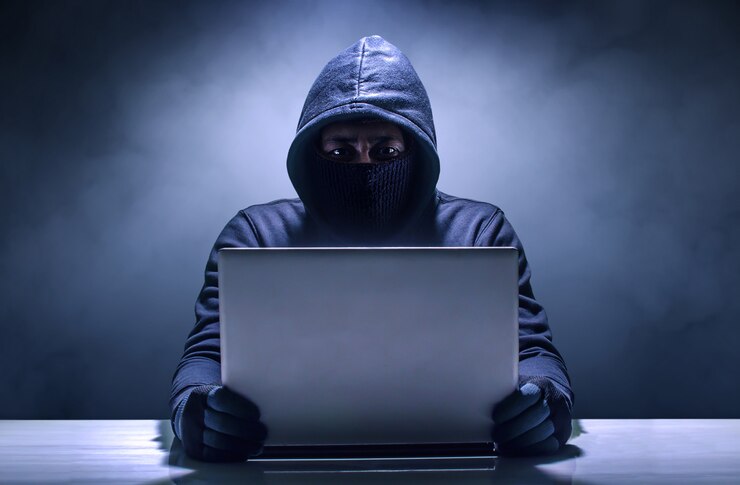 Fotoğraf hacker using laptop. hacking the internet.
