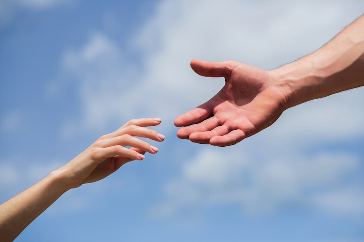 Fotoğraf hands of man and woman reaching to each other, support.