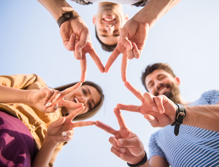 Fotoğraf happy people make stars with fingers.