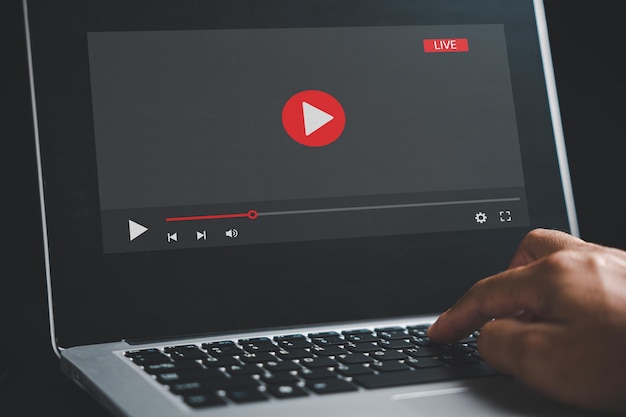 in the realm of online learning a man dedicates himself to his laptop screen seamlessly transitioning between video playback educational webinars and the digital landscape of elearning
