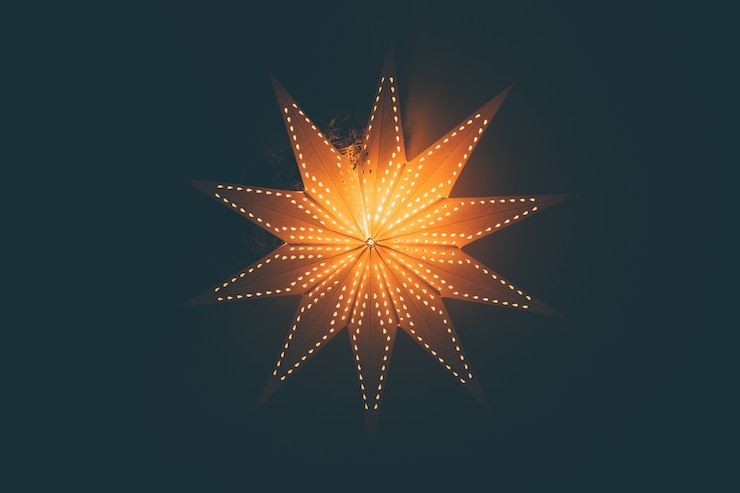 Fotoğraf lit up glowing christmas star background