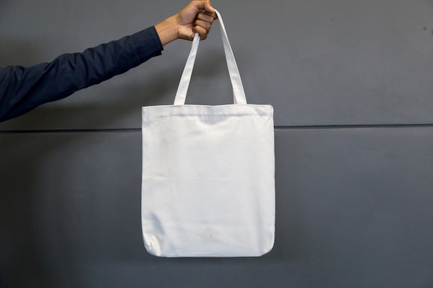 man holding bag canvas fabric for mockup,ecology concept.
