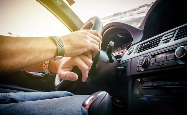 Midsection of man driving car
