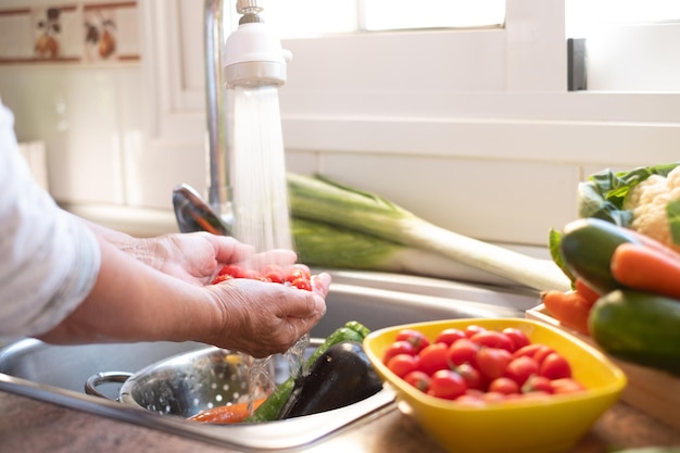 midsection of man preparing fruits in kitchen
