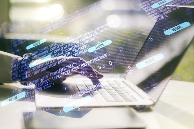 Multi exposure of abstract software development hologram with world map and hands typing on computer keyboard on background global research and analytics concept