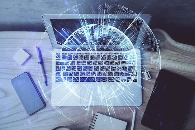 Multi exposure of business theme icons and work space with computer background Concept of success