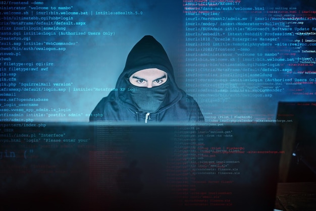 No system is safe from him Shot of a young hacker using a computer late at night