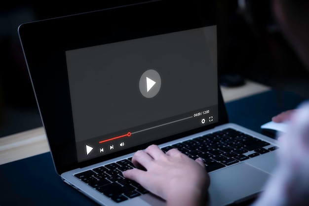 person using computer for watching video on the internet watch movies listen to music for entertainmentlive contentshow or tutorialstream gamesrecord voice content streaming