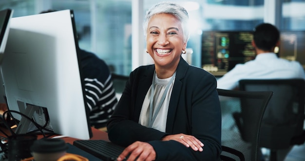 Portrait woman and developer with pc in office for programming software update and IT career Mature person computer and coding pride for website development testing server and system application