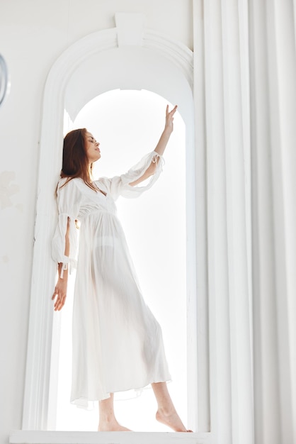 Pretty woman in white dress glamor posing fashion