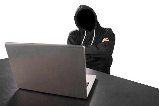 Programmer looks thinking with laptop on table