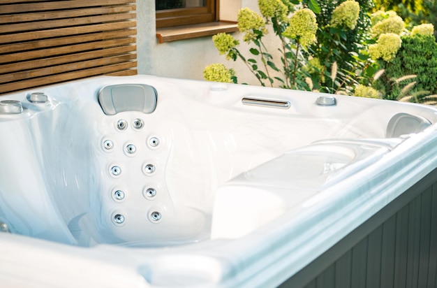 Relaxing Hot Tub for Outdoor Enjoyment Surrounded by Lush Greenery on a Sunny Day