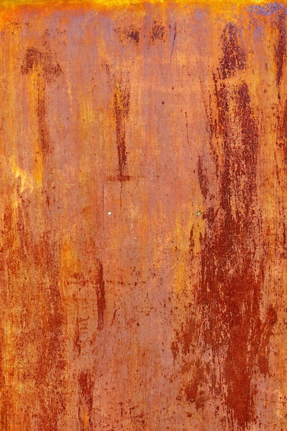 Rusty flat sheet metal surface fullframe background and texture with leftovers of white paint