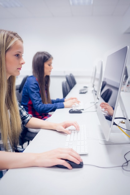serious student working on computer at university 