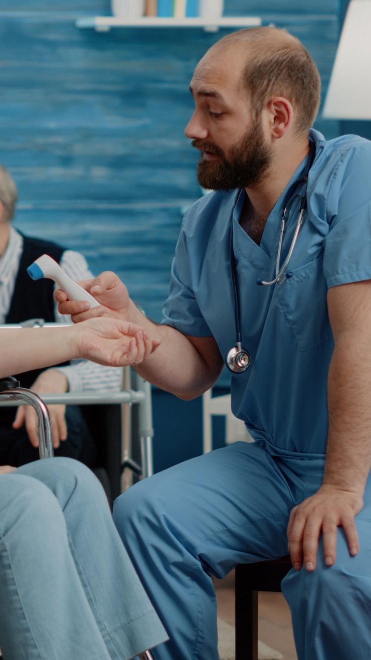 Fotoğraf side view of doctor examining patient at harbor