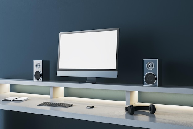 simple dark blue designer workplace with empty mock up computer screen loud speakers and other items 3d rendering